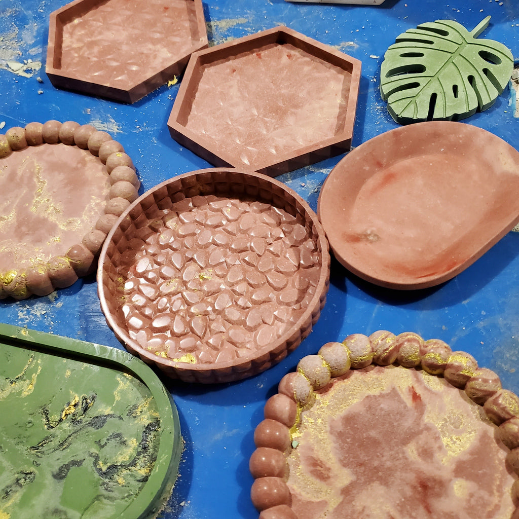 A variety of handcrafted concrete decorative trays